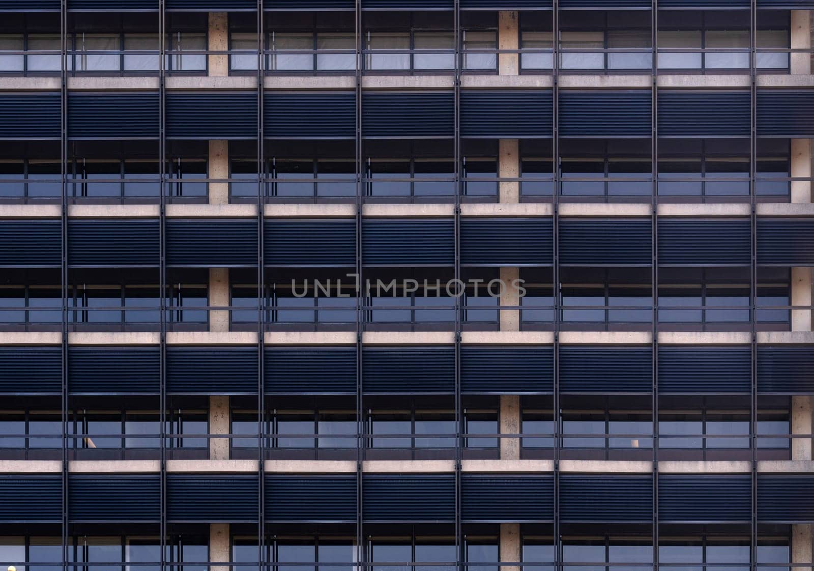 Urban abstract - window facade of business center office building with reflections and colours. Philadelphia PA USA