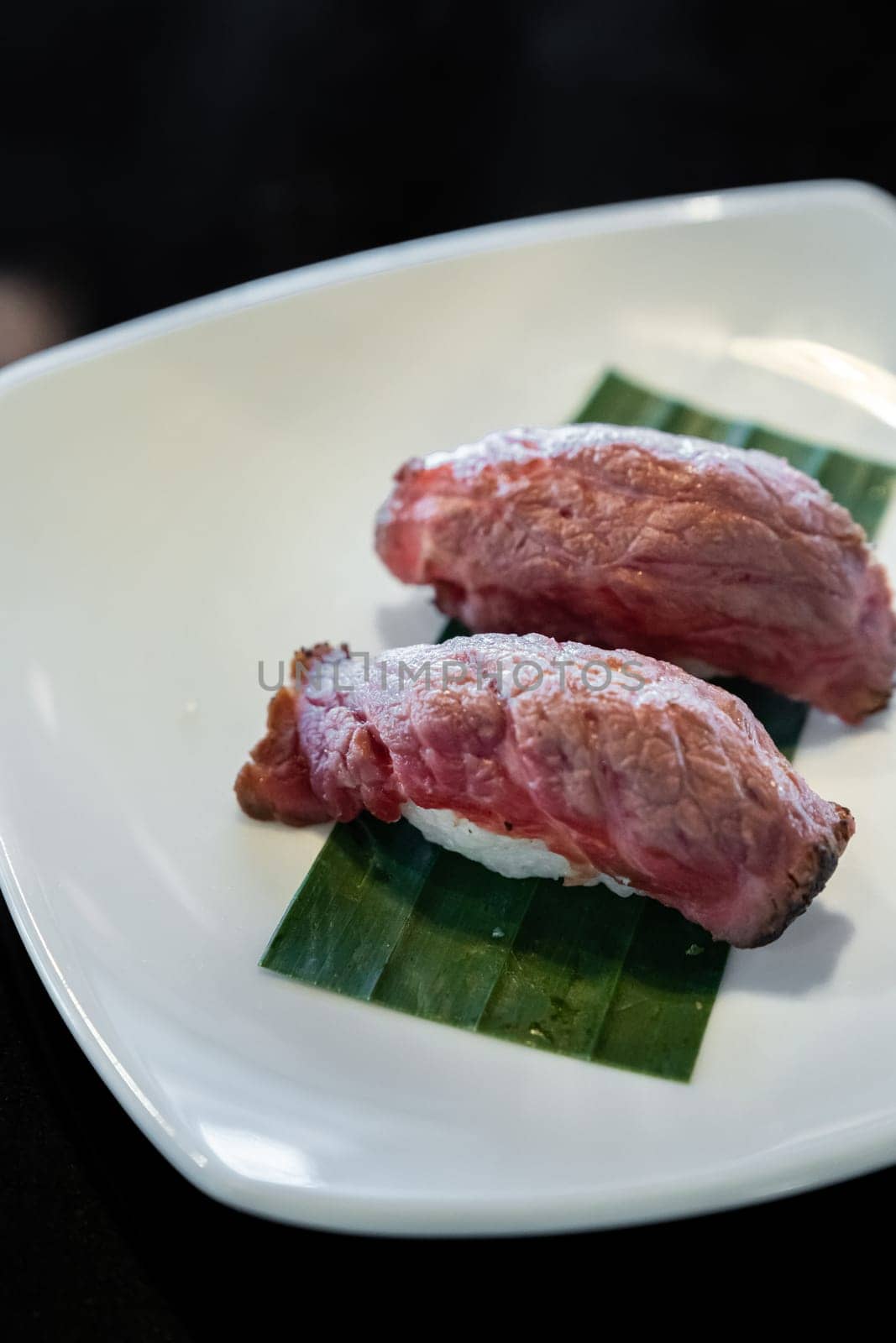 Wagyu beef sushi, japanese groumet cuisine, on white plate