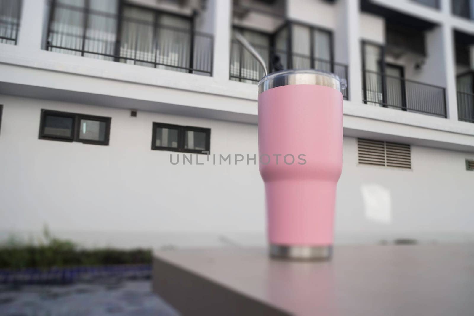 Thermos tumbler mug that made of stainless steel with metal drinking straw, stock photo