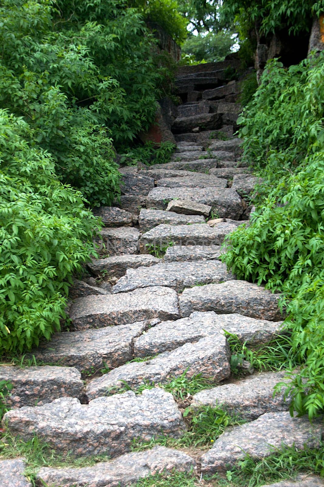 Narrow trekking pavement laid with rock-cut slabs at Ramagiri near Ramanagara, Karnataka, India, Asia