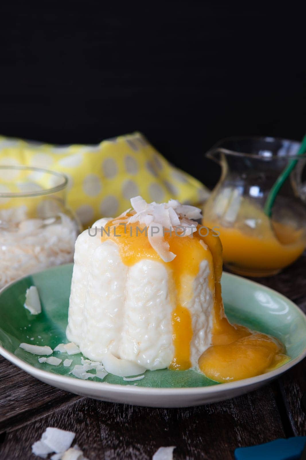 Exotic vegan rice pudding with coconut and mango sauce