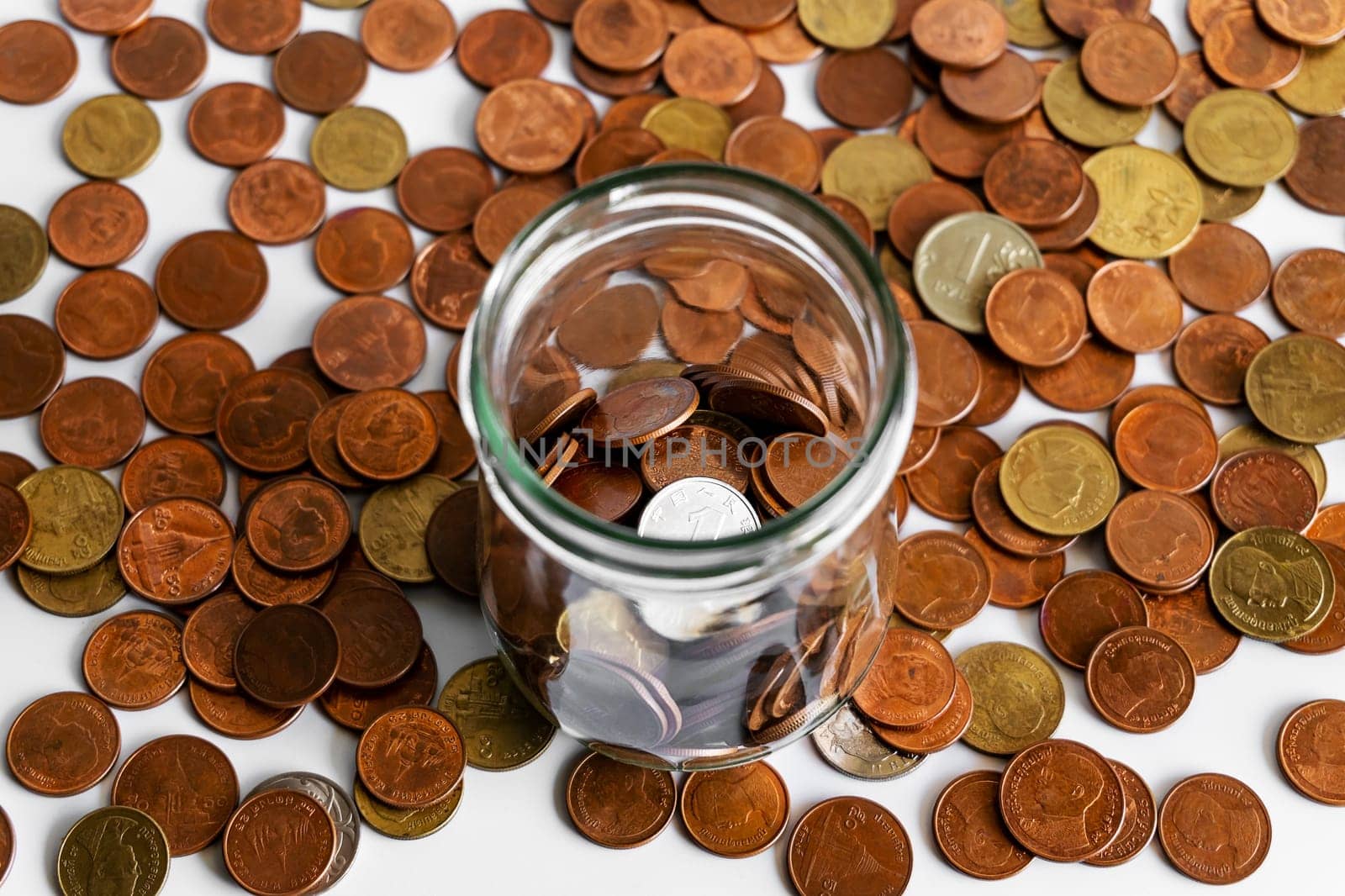 Growing money, Save money and account banking for finance business concept, Coin in bottle on white background, Savings for retirement and investing concept