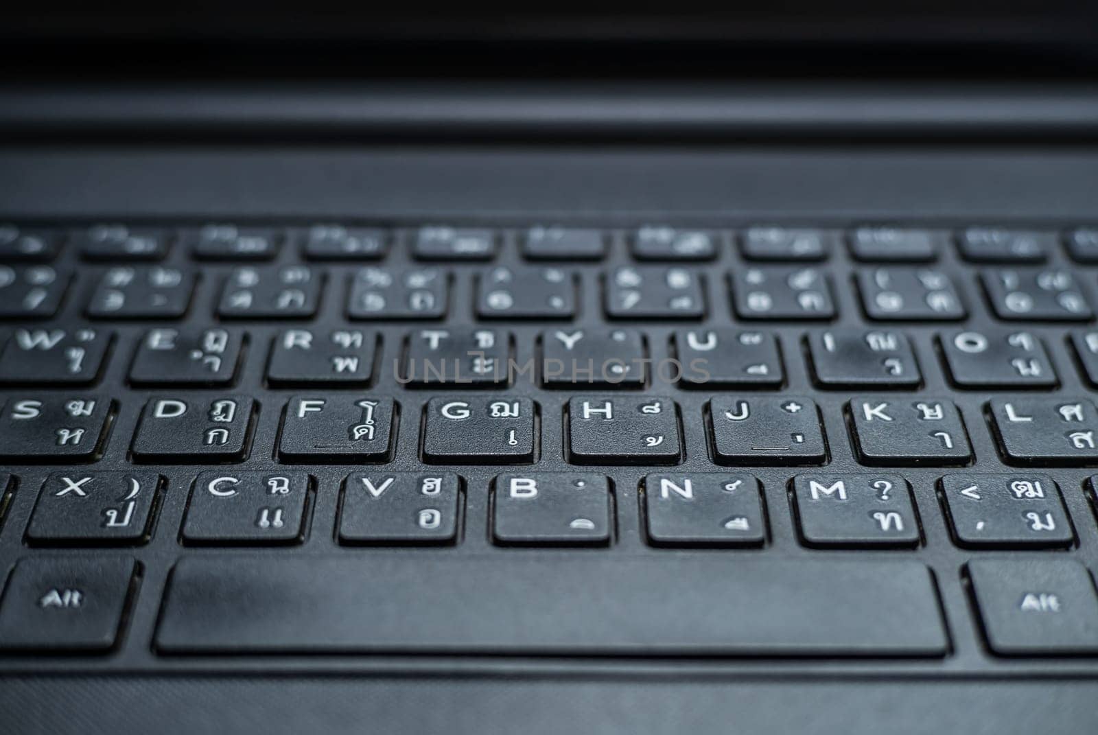 Technology and connecting concept, Keyboard on notebook computer blurred background
