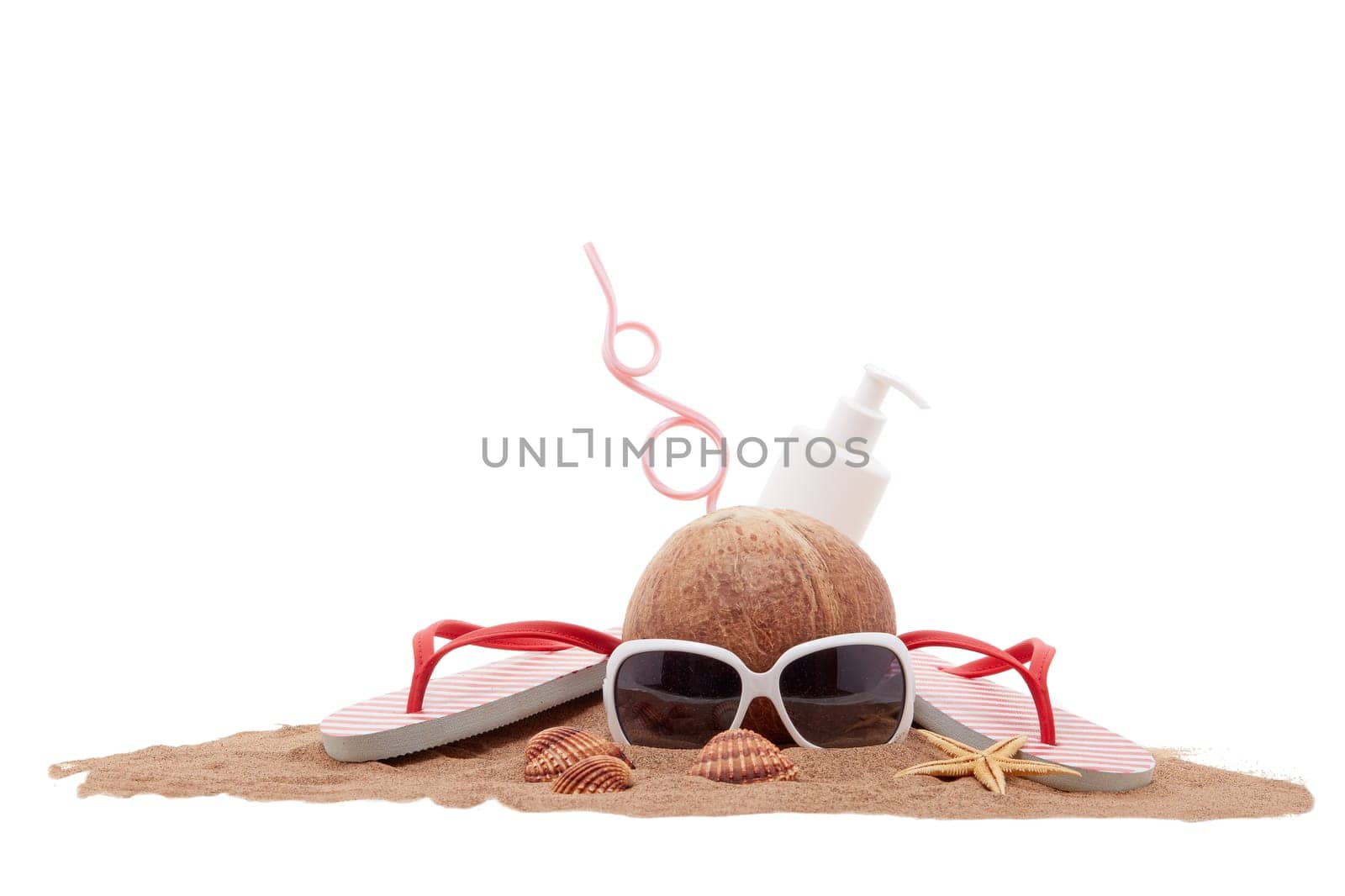 Beach accessories: flip flops, sunglasses, sunscreen, seashells and coconut drink, lying on the sand on white background. Concept of sea vacation and travel. Summer background, Protection from uv