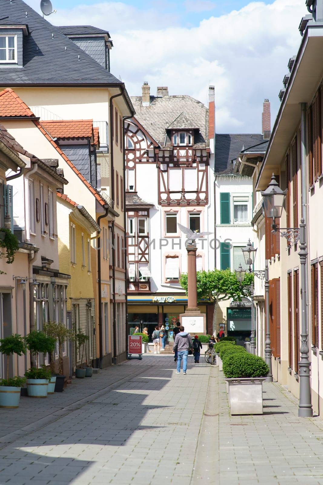 Bad Homburg, Germany - June 09, 2019: A narrow alley with old historic houses overlooking the Waisenhaus Square on June 09, 2019 in Bad Homburg...