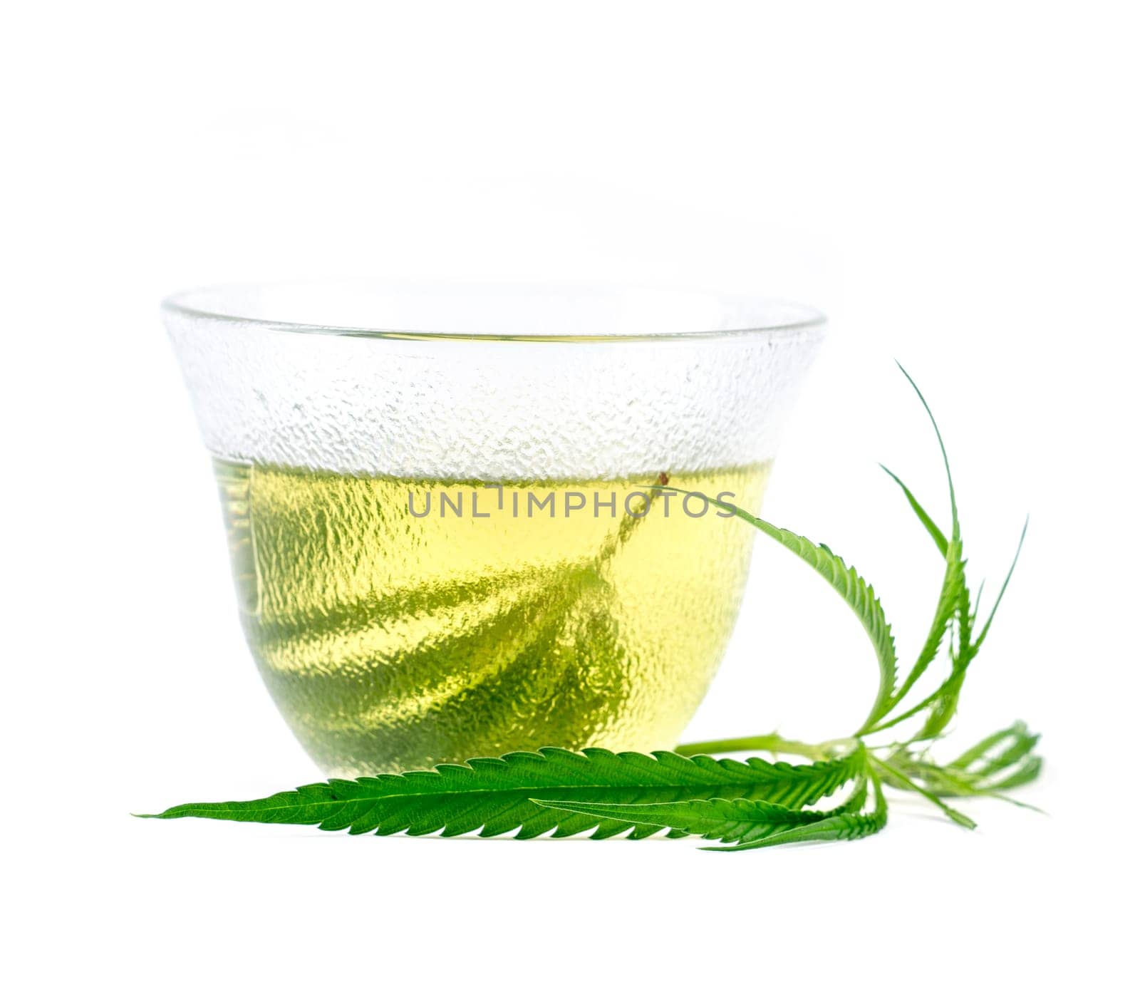 marijuana herbal tea served in glass teacup