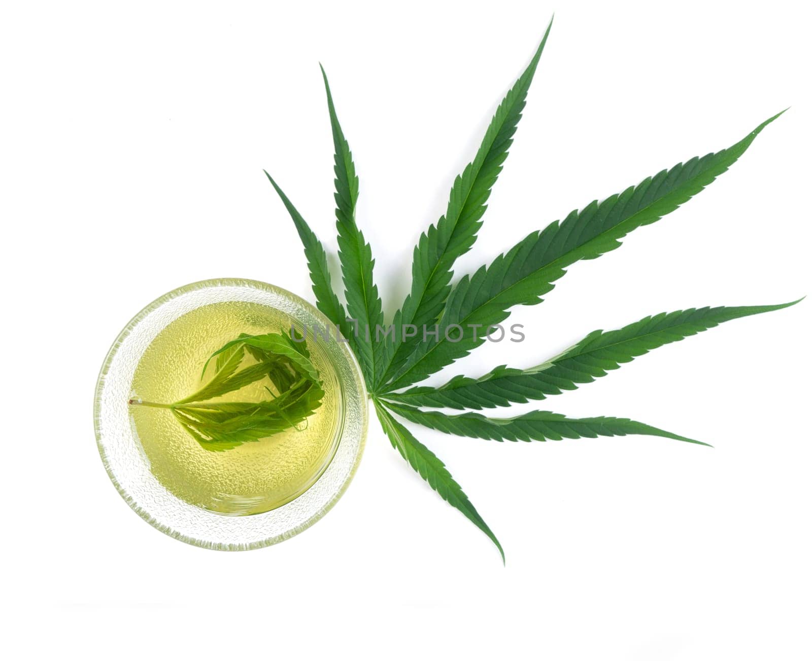 marijuana herbal tea served in glass teacup
