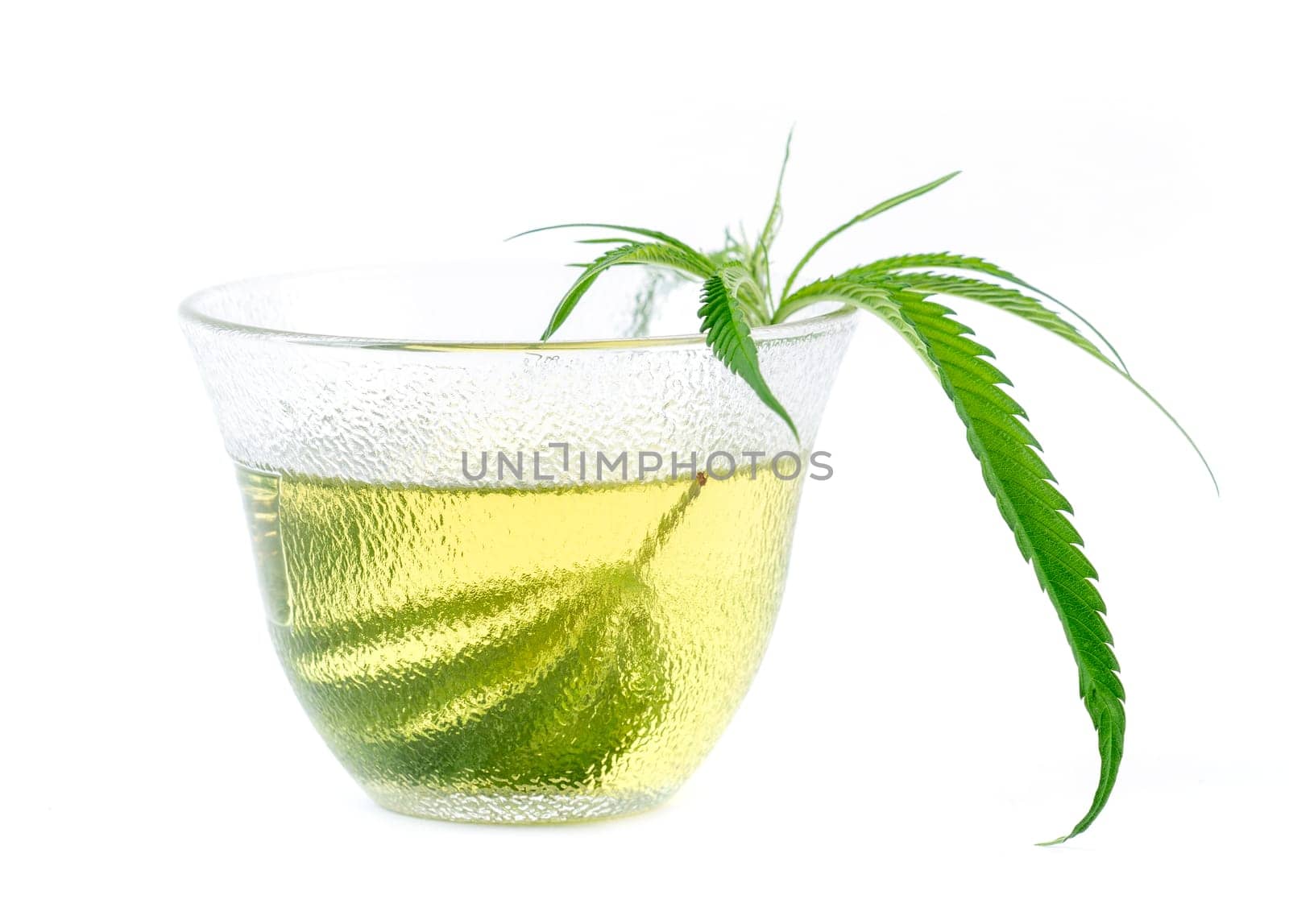 marijuana herbal tea served in glass teacup