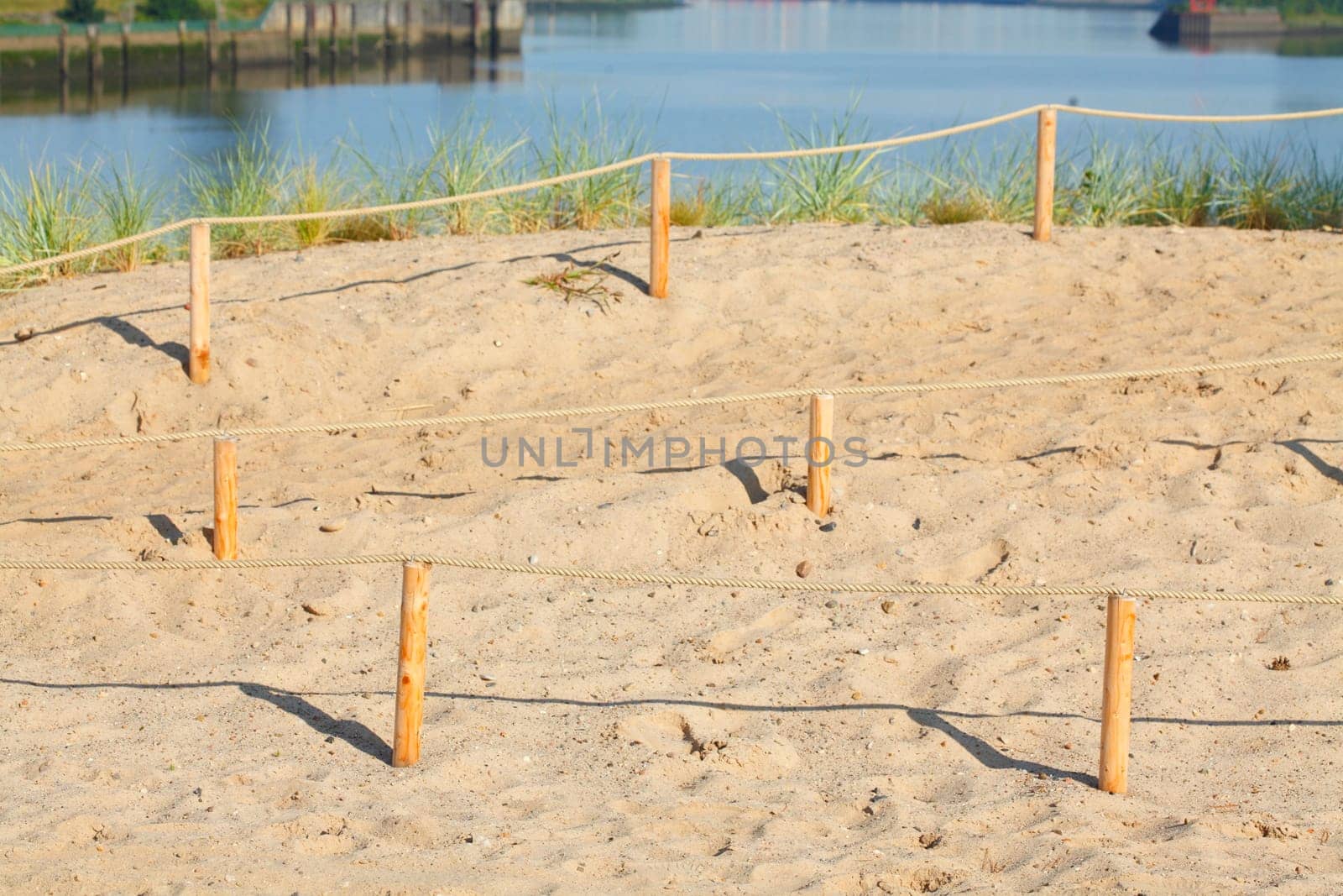 Sand dunes with path and fence, Germany, Europe..