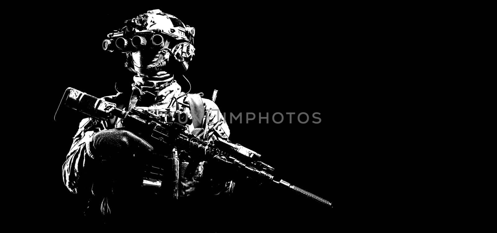 Army infantry in battle uniform, armed assault rifle with laser sight and silencer, standing in darkness, looking through night vision goggles, low key half length, studio portrait on black background