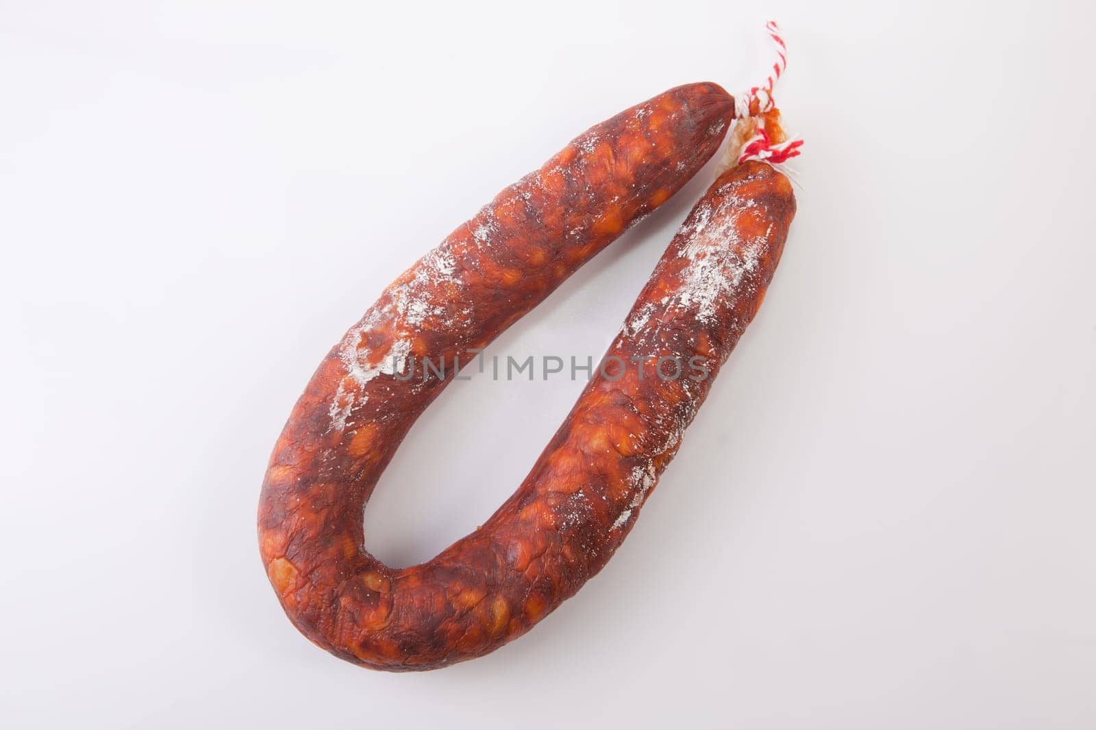 Red spanish chorizo sausage. Isolated over white background