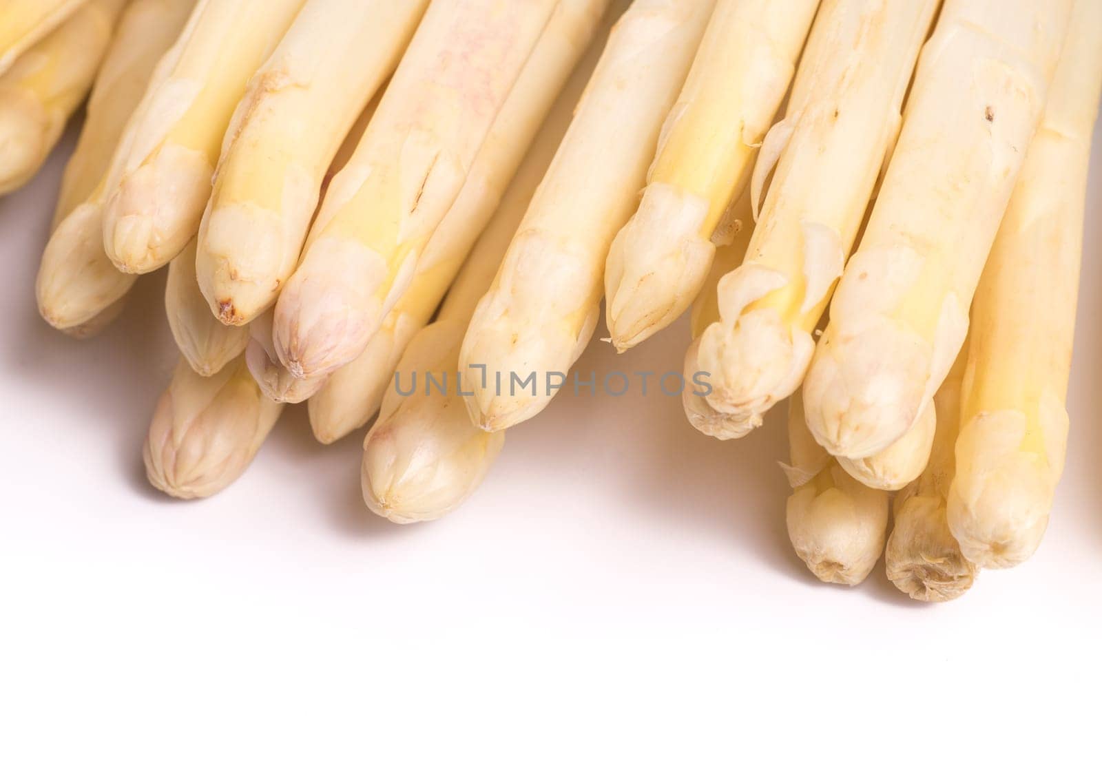 bundle of organic asparagus isolated on white background