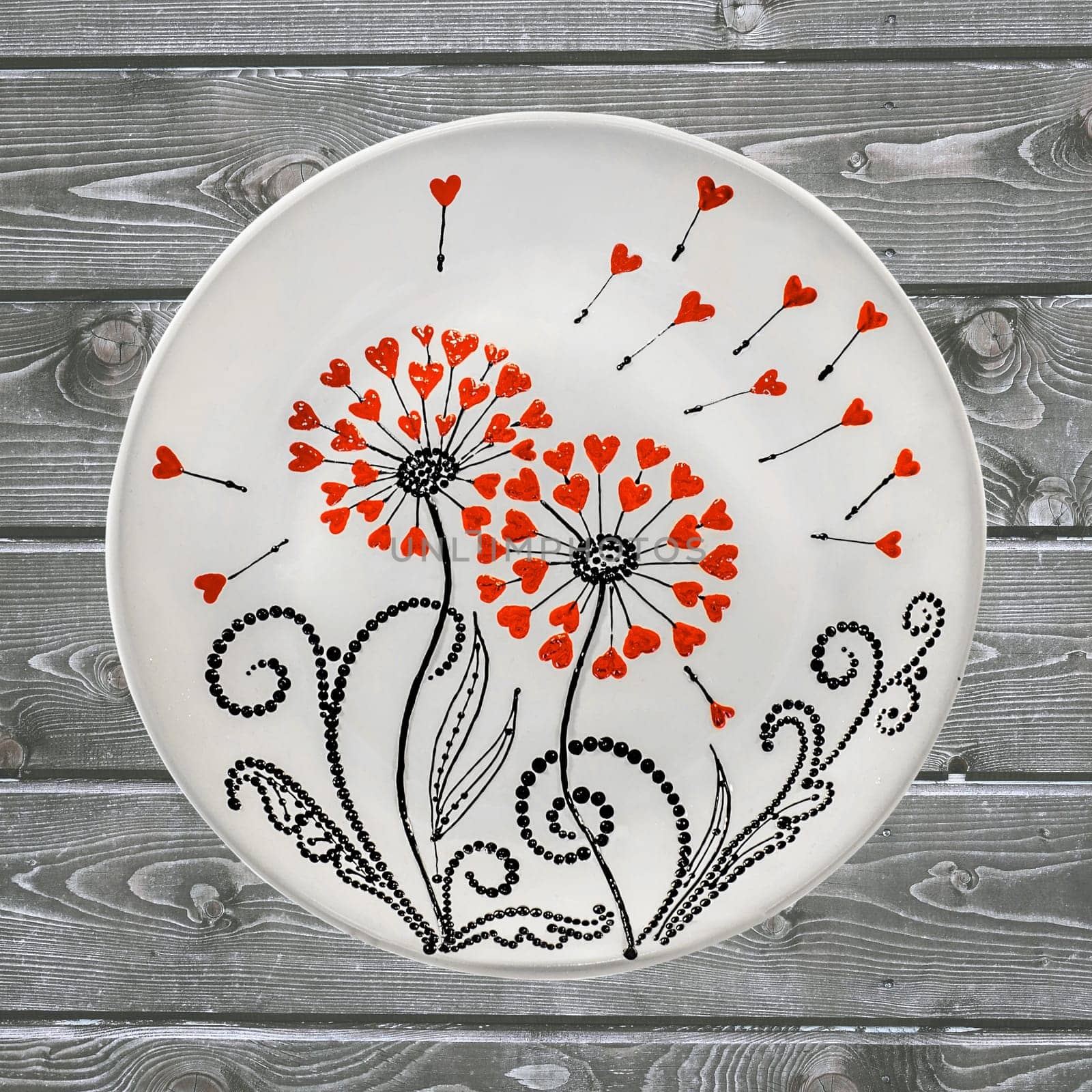 Decorative ceramic dish painted with hands. Art, handmade. Pattern mandala