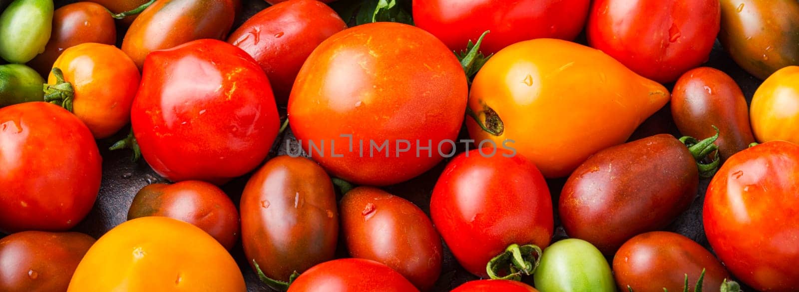 Tomato seasonal summer vegetables.Harvest ripe tomatoes.Food background