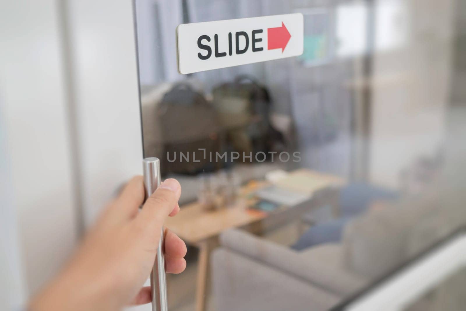Woman hand opening see through door, stock photo