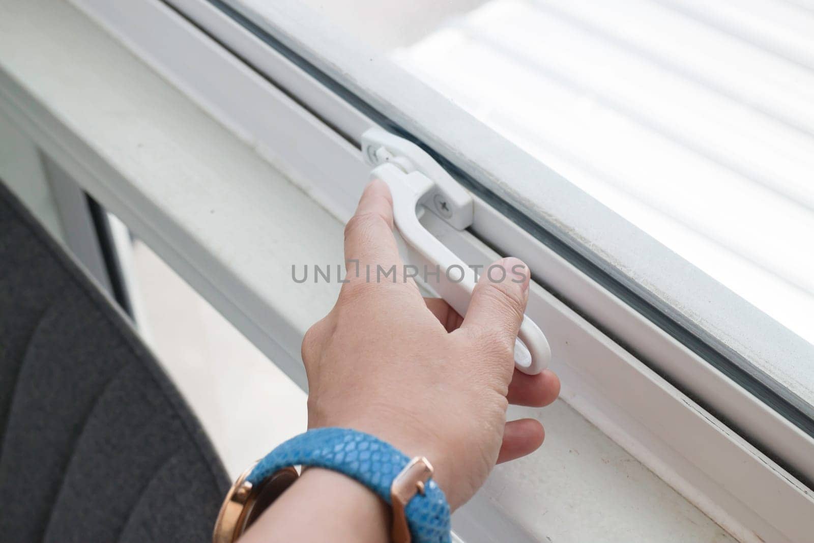 Woman hand opening see through window, stock photo