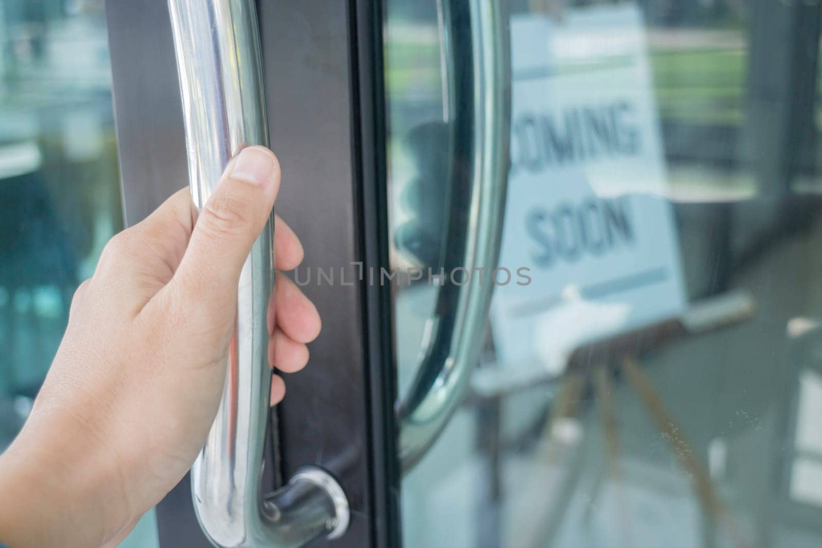 Woman hand opening see through door, stock photo