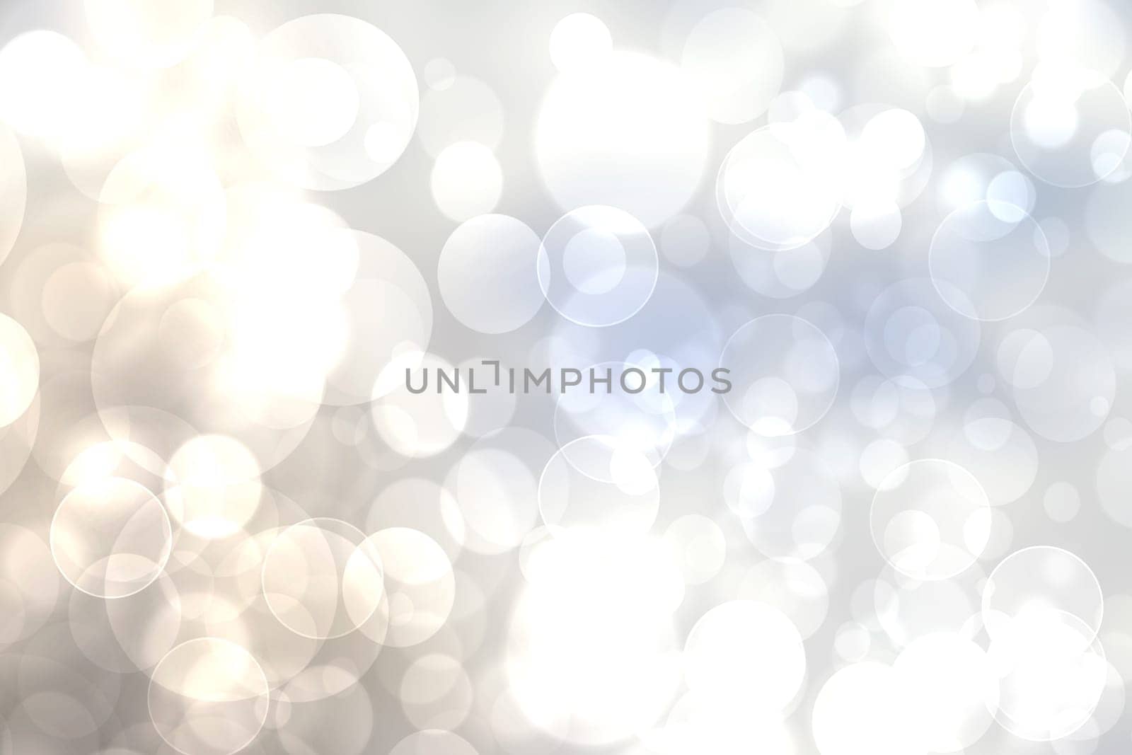 Abstract festive light blue gradient silver beige bokeh background texture with colorful circles and bokeh lights. Beautiful backdrop with space.