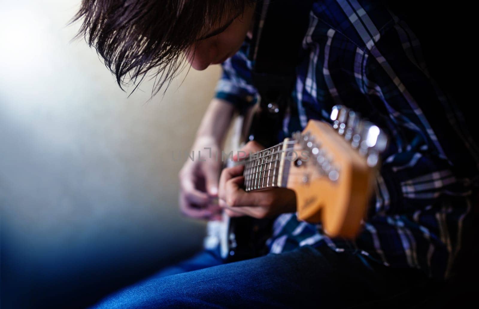 CHISINAU, MOLDOVA - June 27, 2019: Electric guitar playing. Young men playing electric guitar. Closeup Photography.