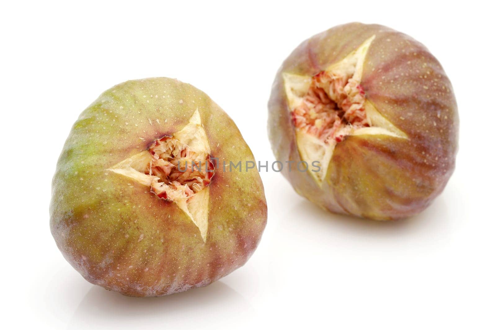 Ripe sweet fig isolated on a white background
