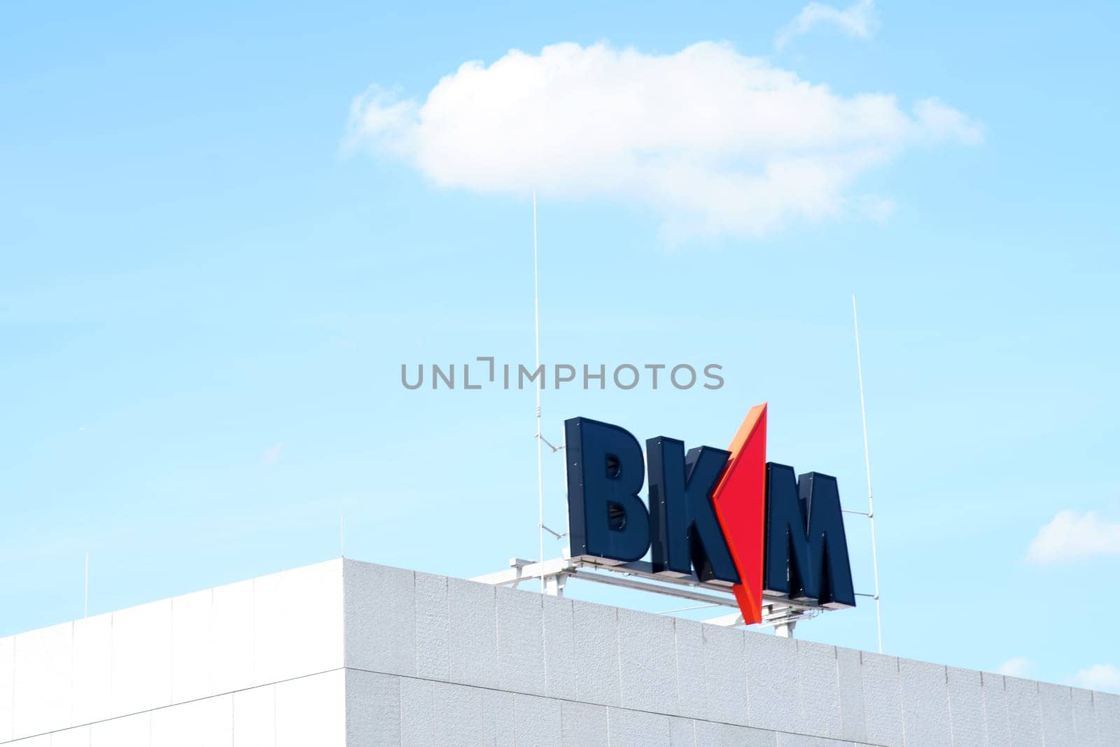 Mainz, Germany - August 04, 2019: The logo of the construction insurance BKM Mainz on the roof edge of a business building on August 04, 2019 in Mainz...