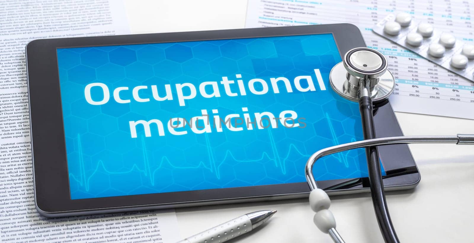 The word Occupational medicine on the display of a tablet