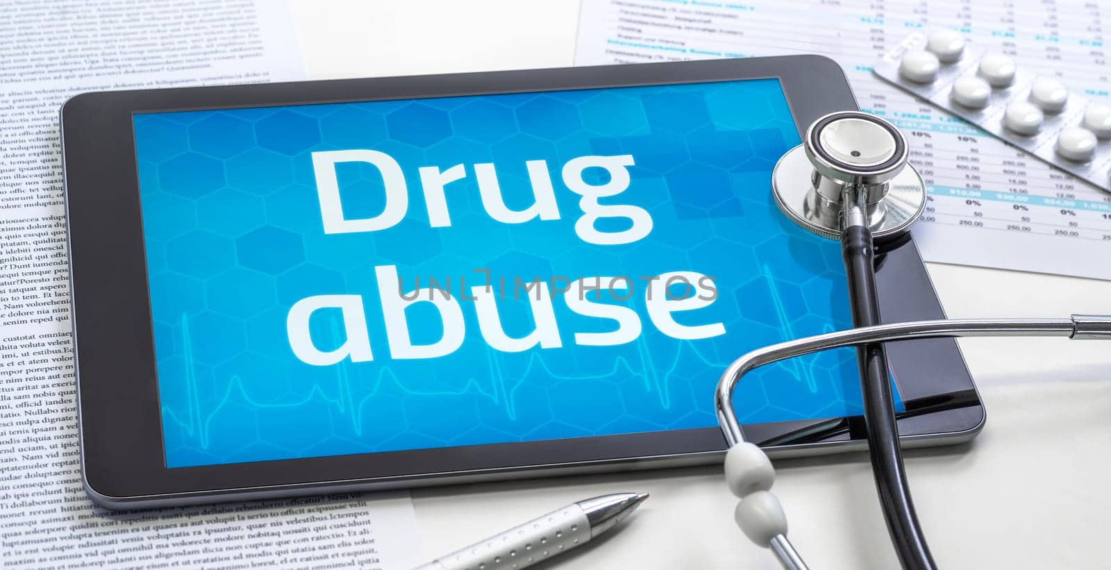 The word Drug abuse on the display of a tablet