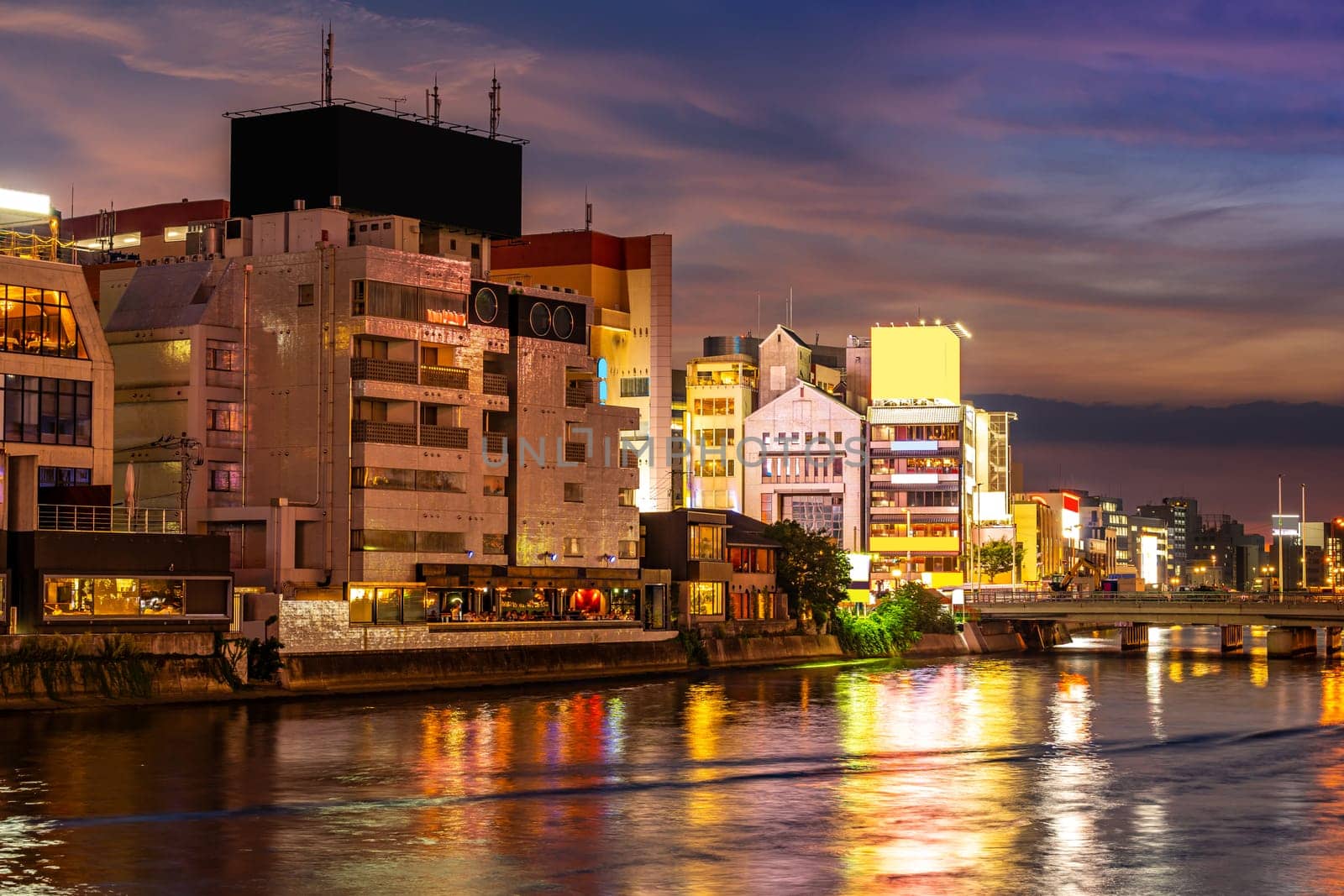 Fukuoka old town along naka river at Nakasukawabata sunset twilight. This area is favorite for tourist for Fukuoka Yatai, street Food stall,  for hangout at night.