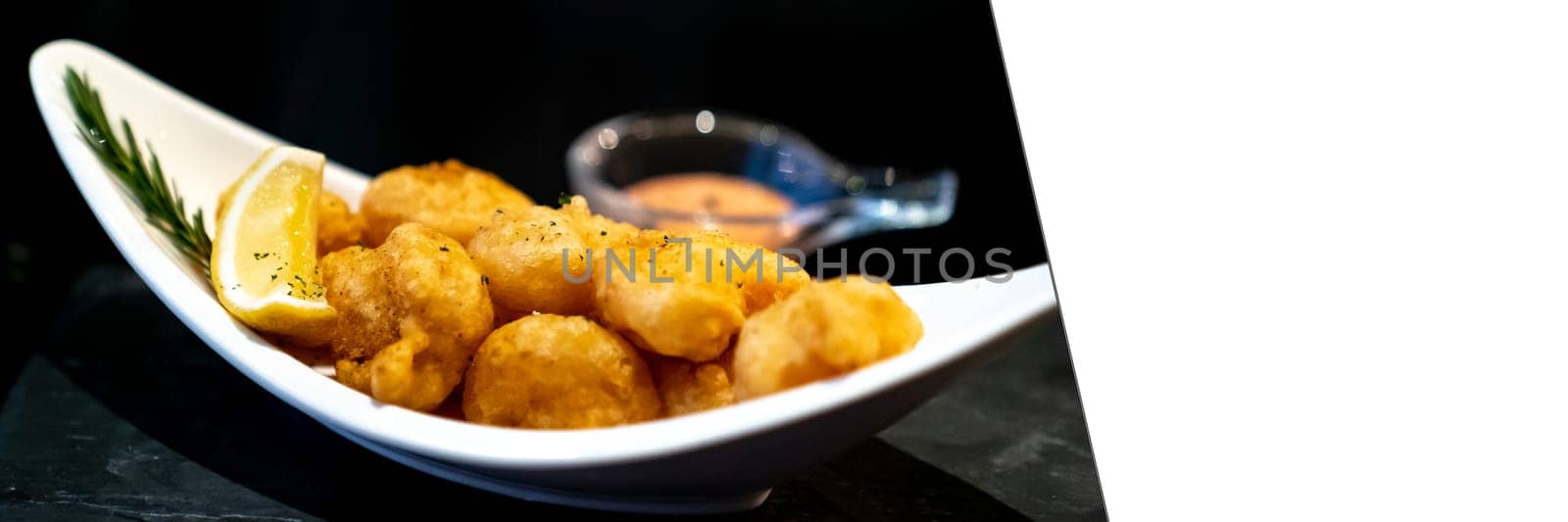 Deep fried shrimp ball with lemon and dipping sauce. Panoramic crop designed for using as web banner