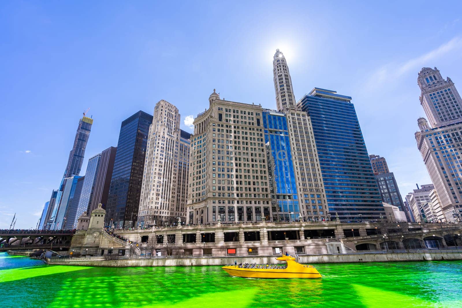 Chicago Skylines building along green dyeing river of Chicago River on St. Patrick day festival in Chicago Downtown IL USA