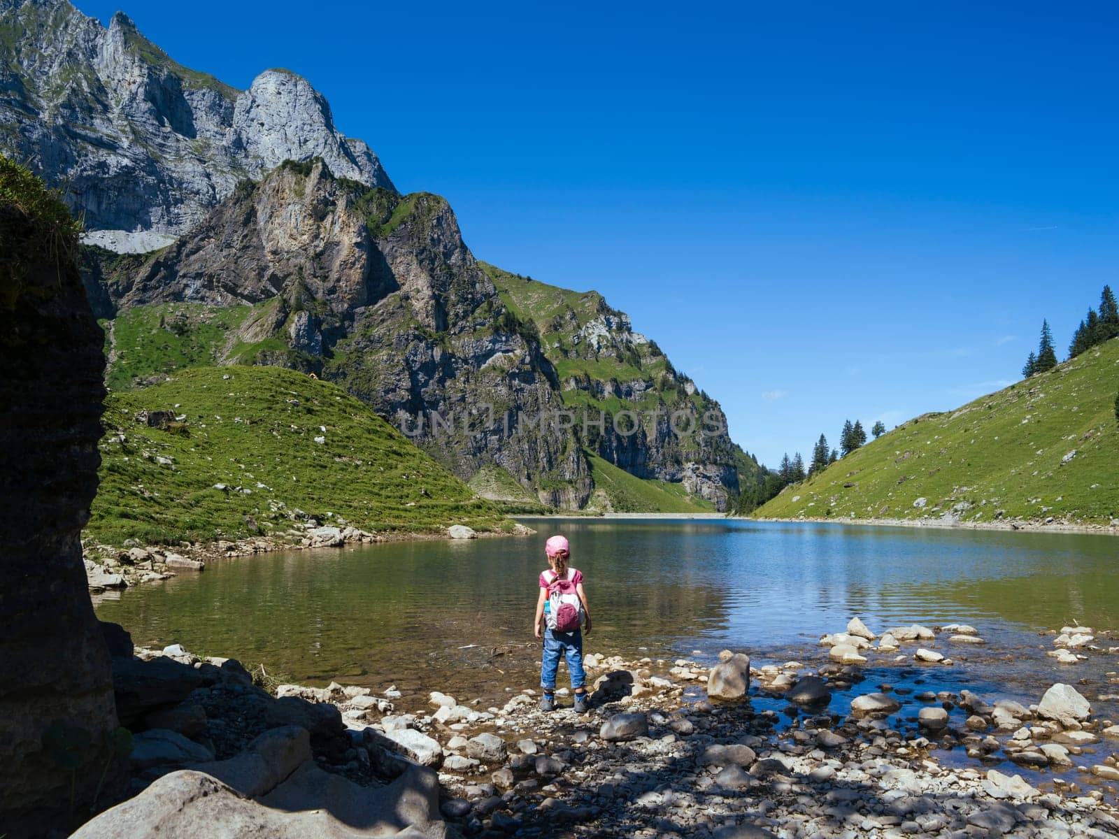 Young girl hiking around Bannalpsee, Bannalp, Nidwalden Switzerland.