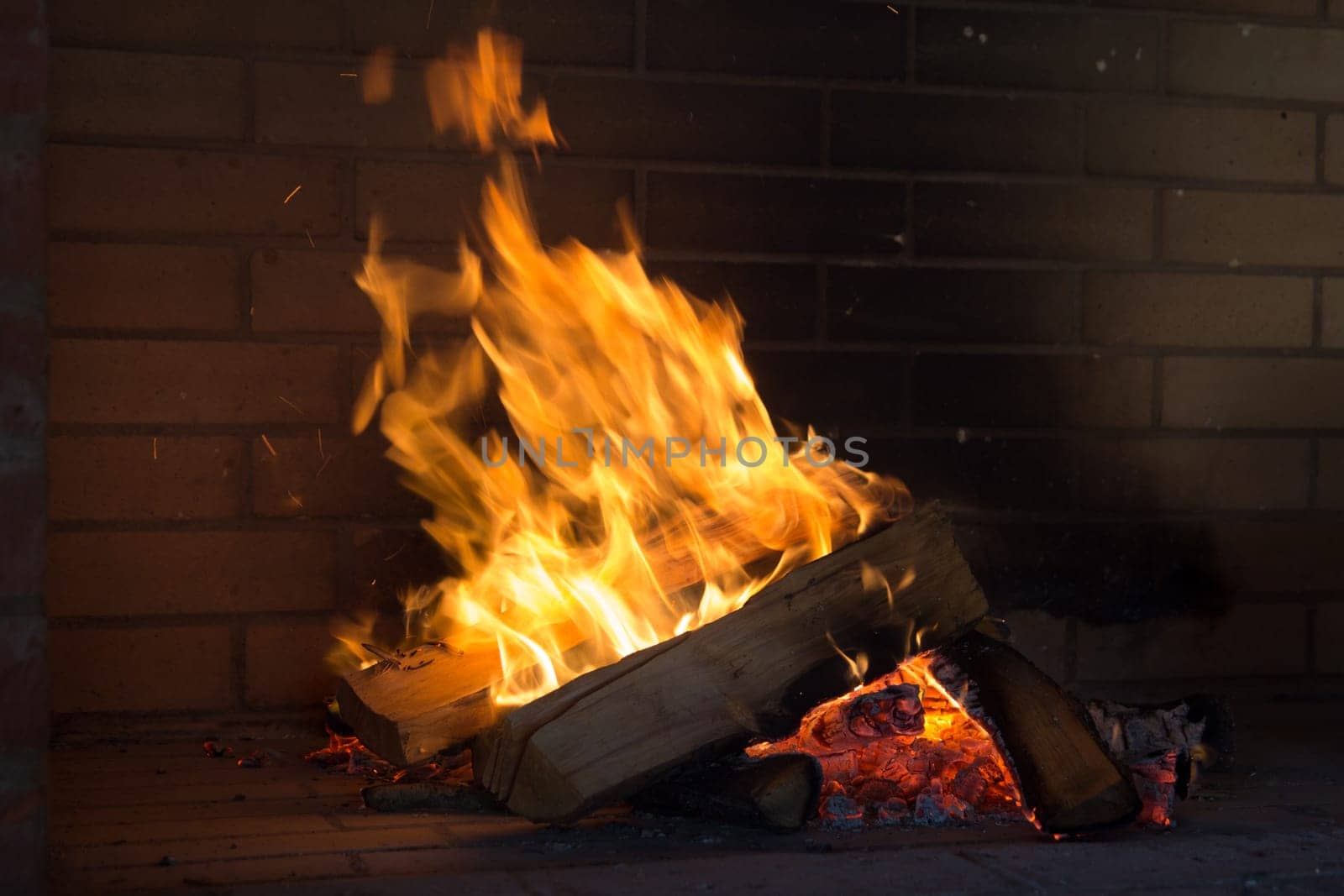 Close up shot of burning firewood in the fireplace.