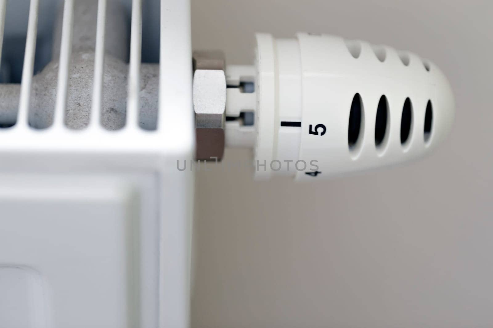 Heating radiator with temperature regulator close-up
