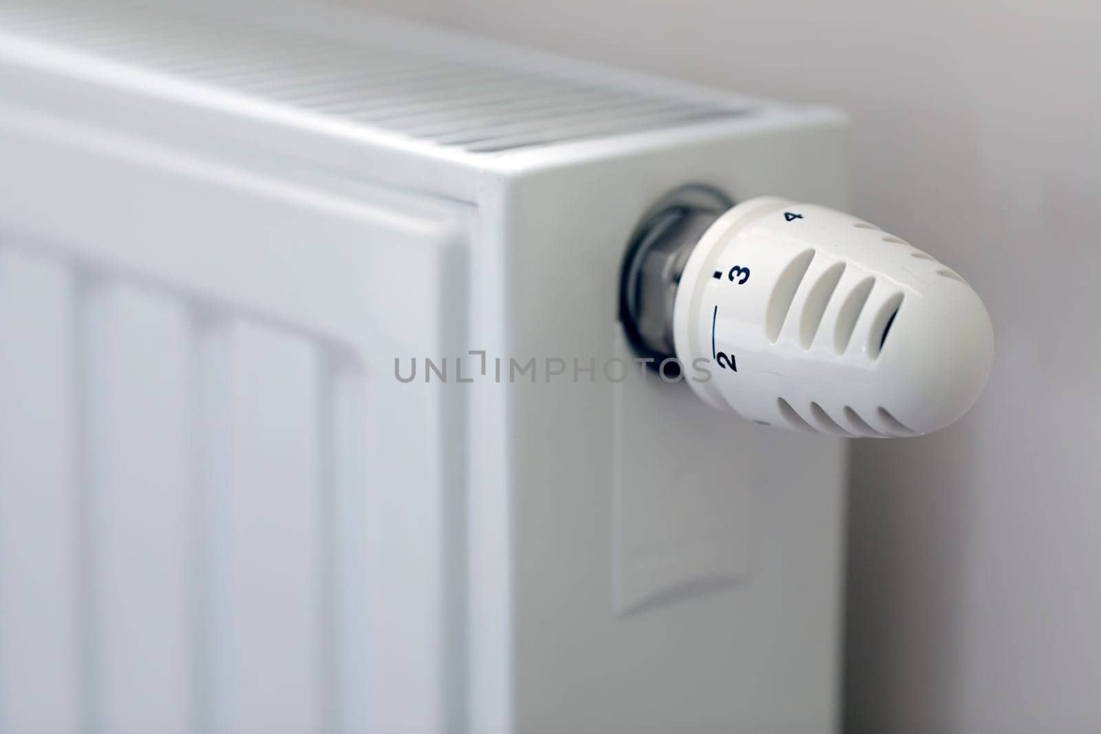 Heating radiator with temperature regulator close-up