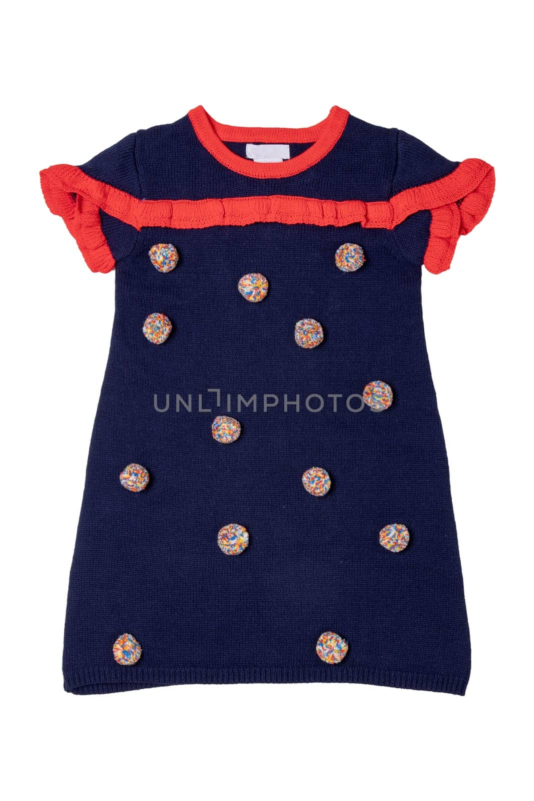 Clothes for children. A beautiful blue sleeveless dress with red collar, ruffles and with fluffy fabric balls isolated on a white background. Little girl autumn and spring fashion.