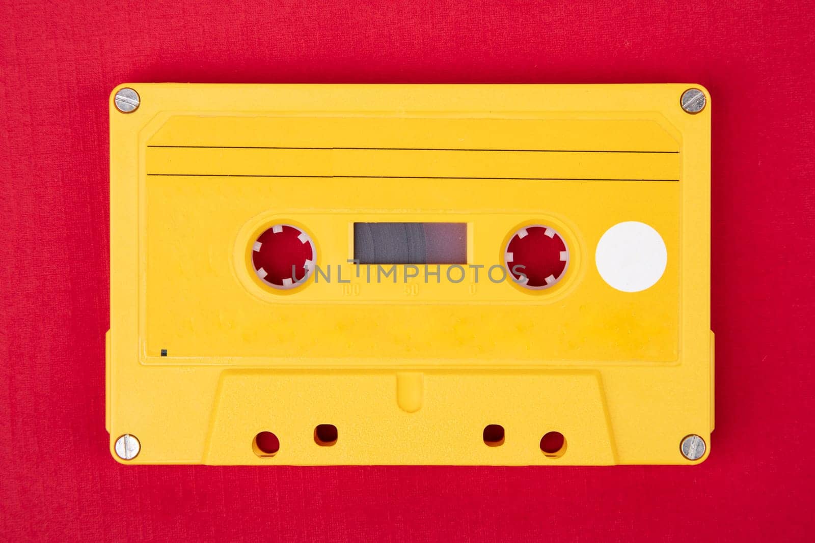 Retro Audio Tape isolated on red background