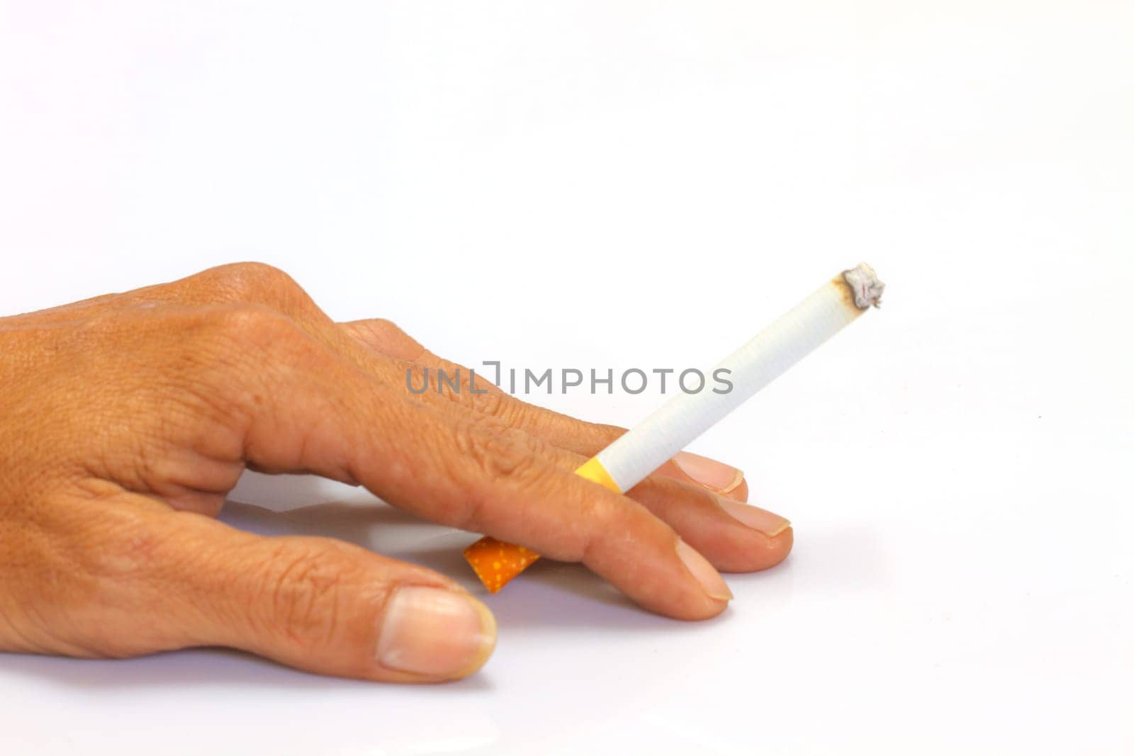 Cigarette in hand  of men on white background