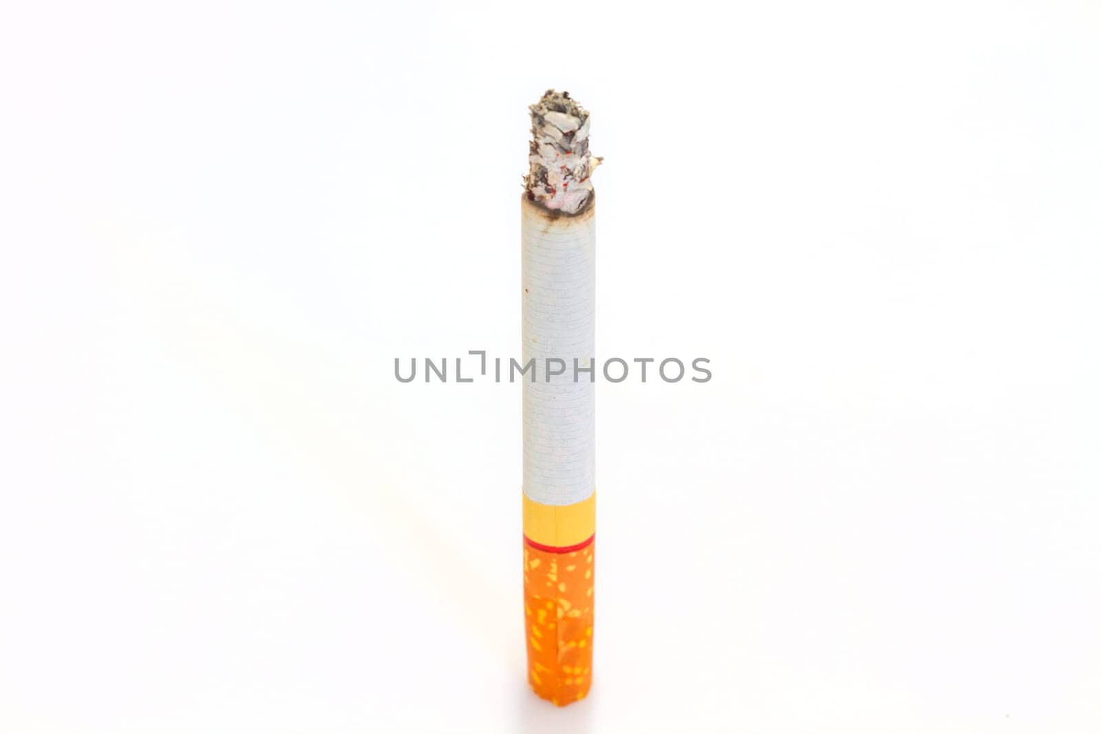Burn cigarette on white background close up