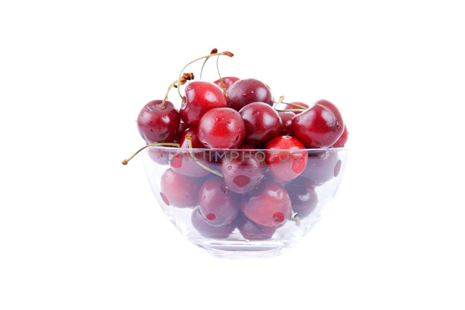 cherries on glass cup isolated on white background