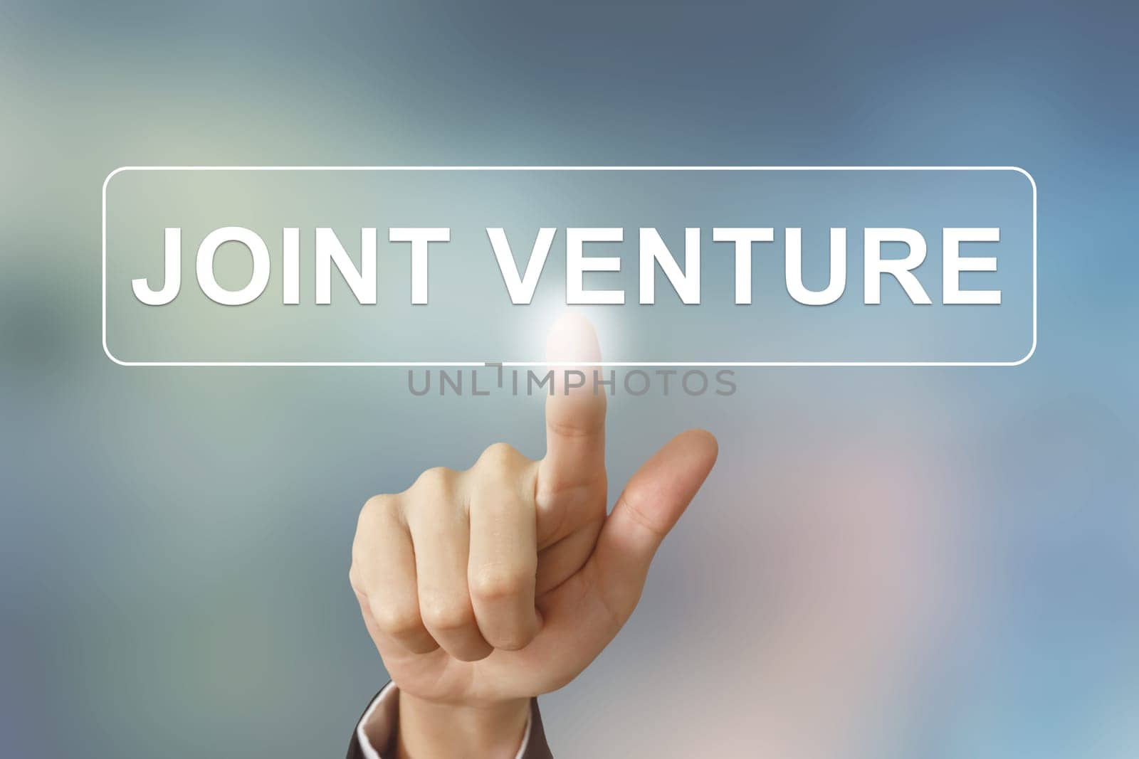business hand pushing joint venture button on blurred background