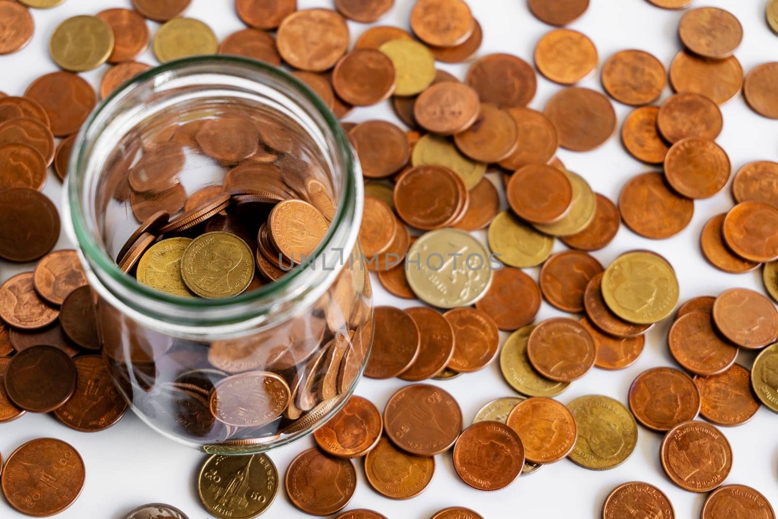 Growing money, Save money and account banking for finance business concept, Coin in bottle on white background, Savings for retirement and investing concept
