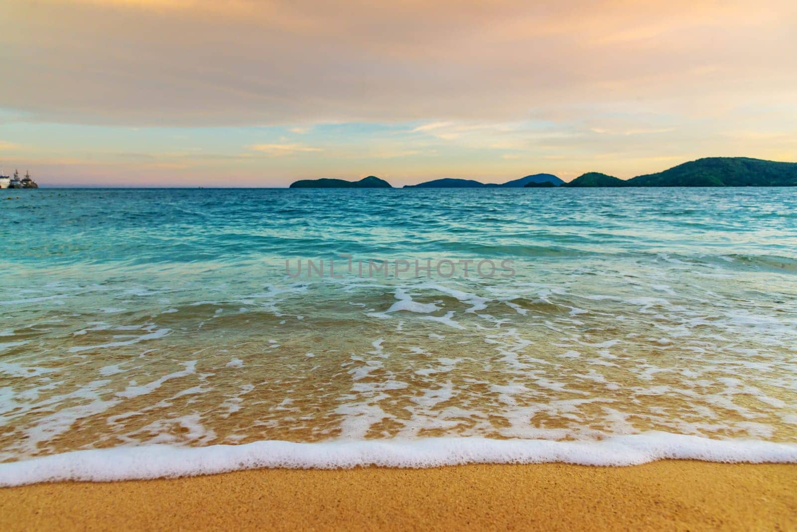 Beach sunset or sunrise with colorful of cloud sky and sunlight in evening light