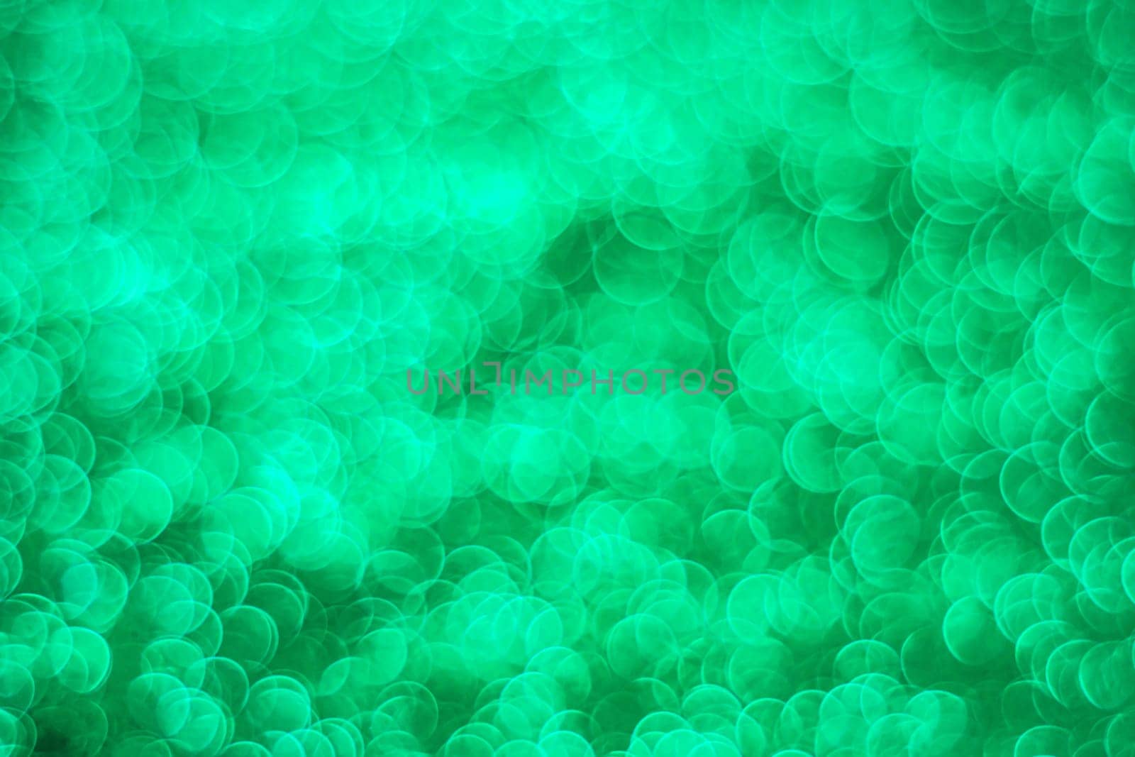 Abstract green light bokeh christmas light blurred background