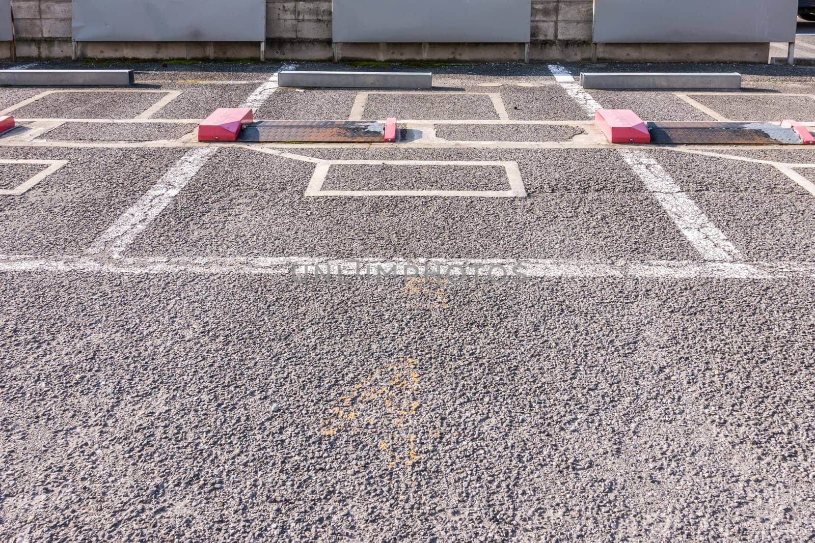 Empty parking lot in outdoor parking area with automatic locking system