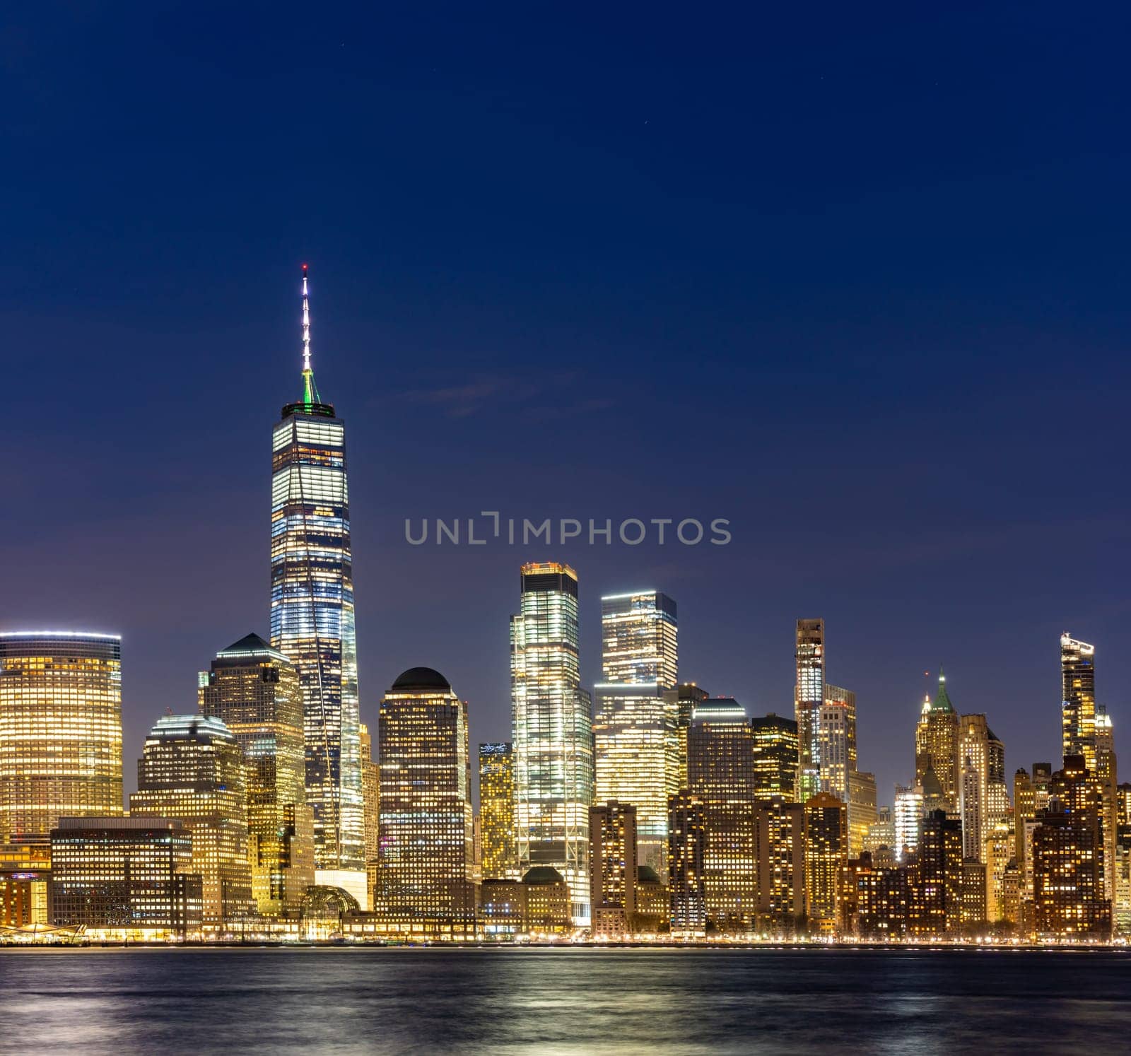 New York city Lower Manhattan skyline cityscape at dusk from New Jersey.