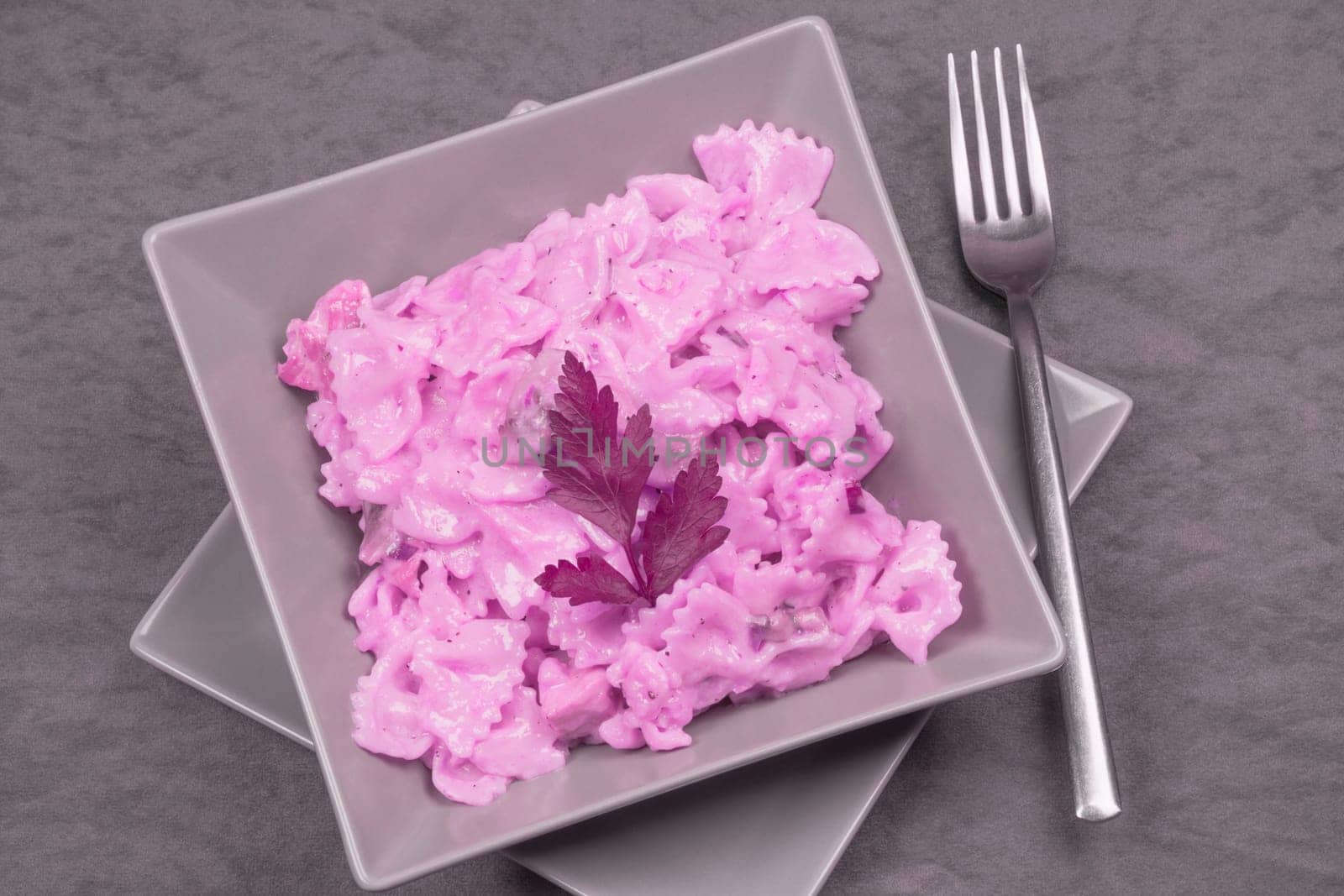 The pasta is in pink sauce, Italian food, modern gastronomy.