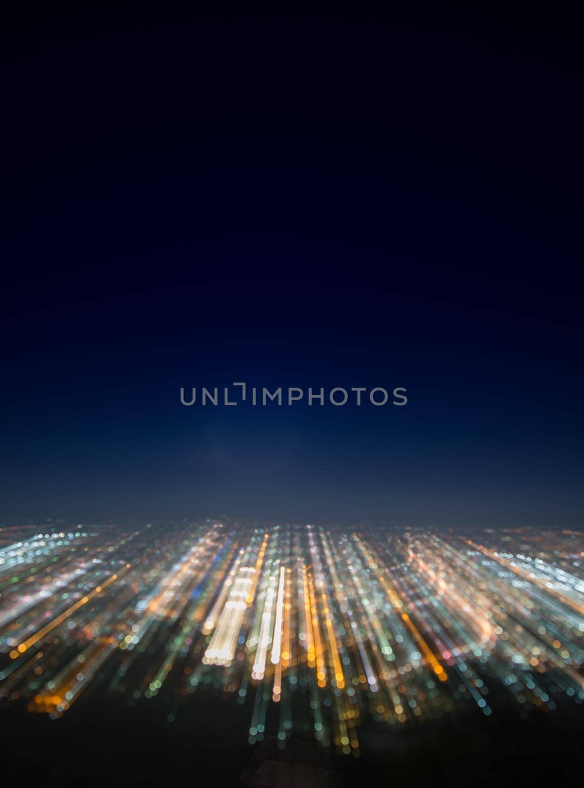 Abstract long exposure, experimental surreal photo, city and vehicle lights at night.