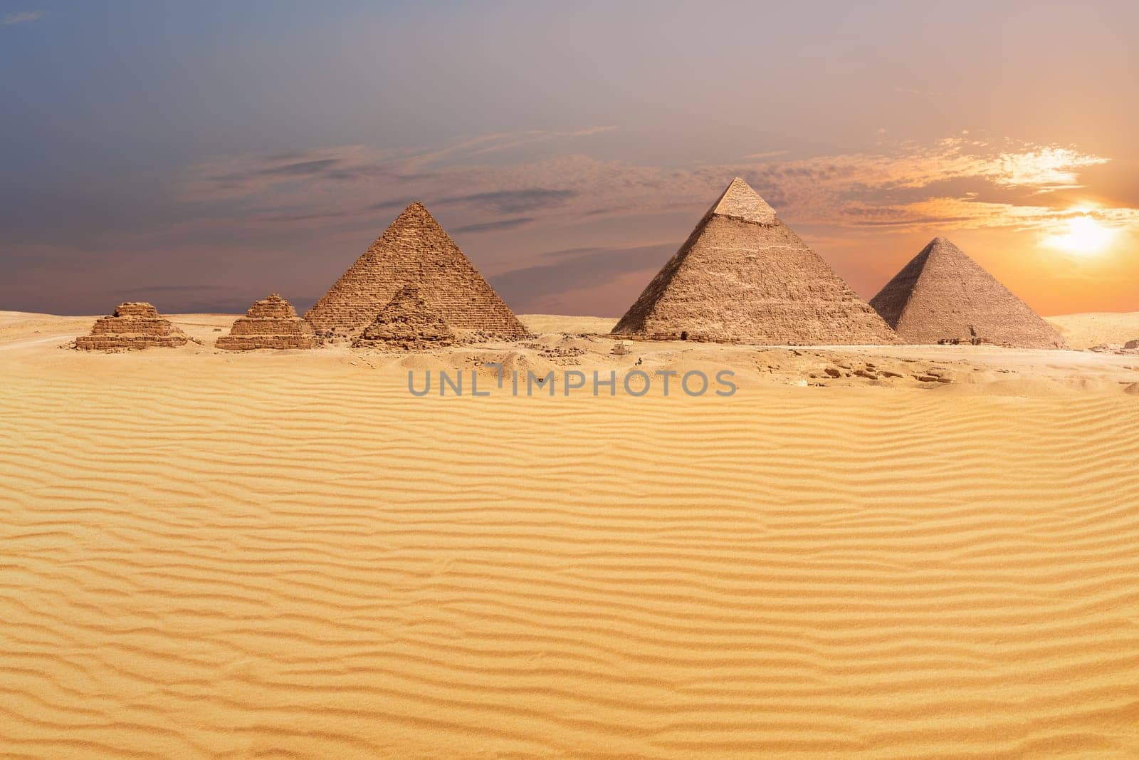 Sandy desert of Giza and beautiful pyramids view.