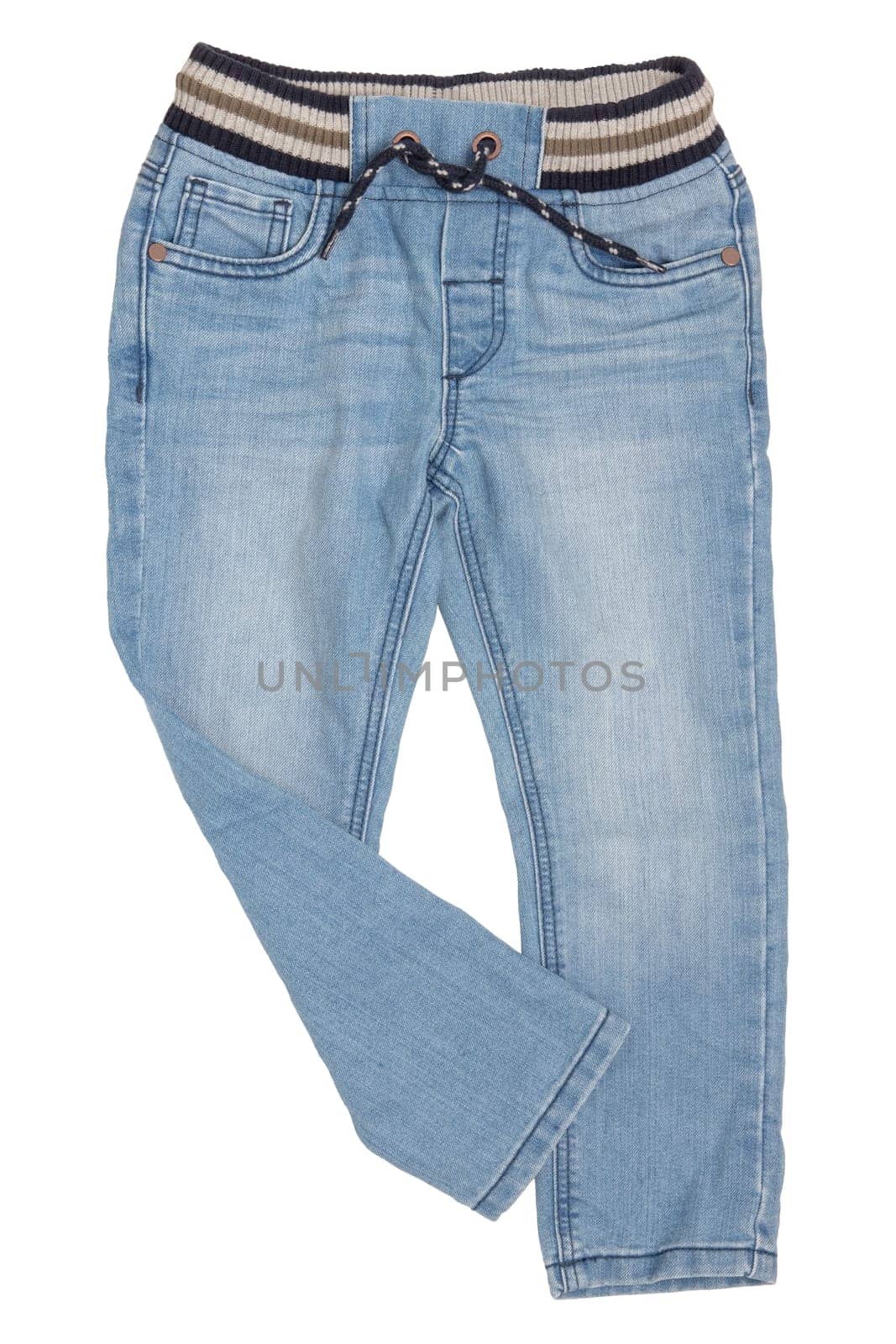 Fashionable denim clothes. Trendy blue jeans trousers with ribbon bow isolated on a white background. Right trouser leg folded. Fashionable jeans for child boy.