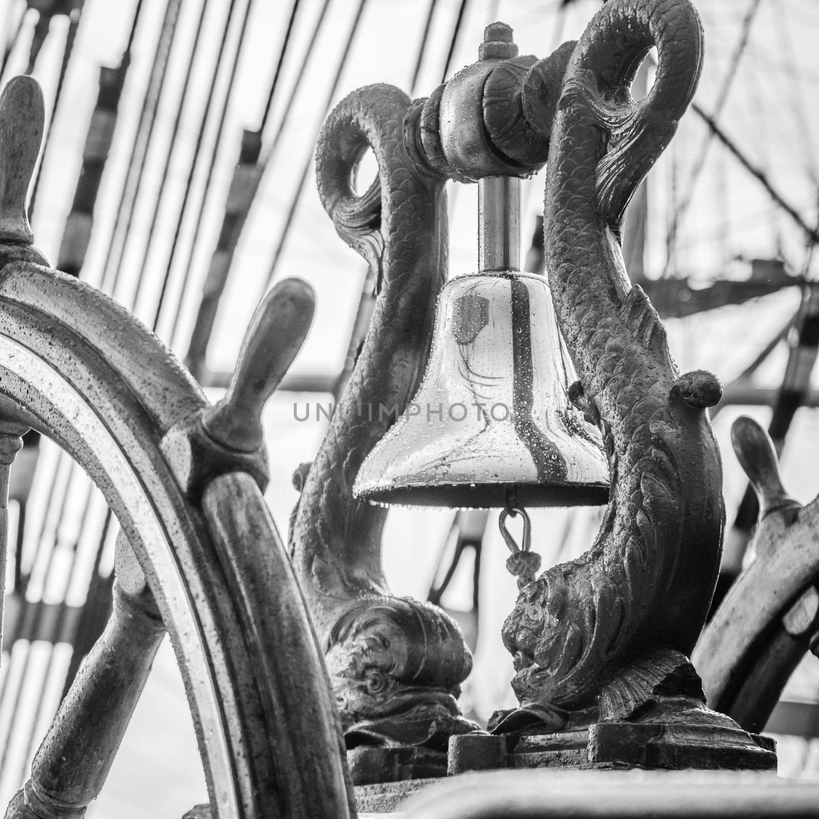Ship's Bell and wheel the old sailboat, close-up